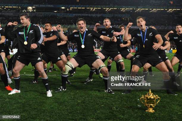 New Zealand All Blacks including captain Richie McCaw perform a victory Haka behind the Webb Ellis cup after the 2011 Rugby World Cup final match New...