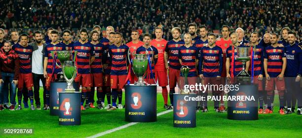 Barcelona players pose with their five trophies Spanish Liga, UEFA Super Cup, UEFA Champions League, FIFA Club World Cup and Spanish Copa del Rey...