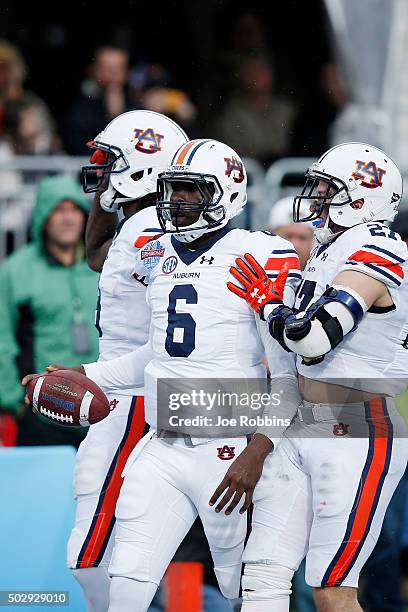 Jeremy Johnson of the Auburn Tigers celebrates after rushing for a five-yard touchdown against the Memphis Tigers in the fourth quarter of the...