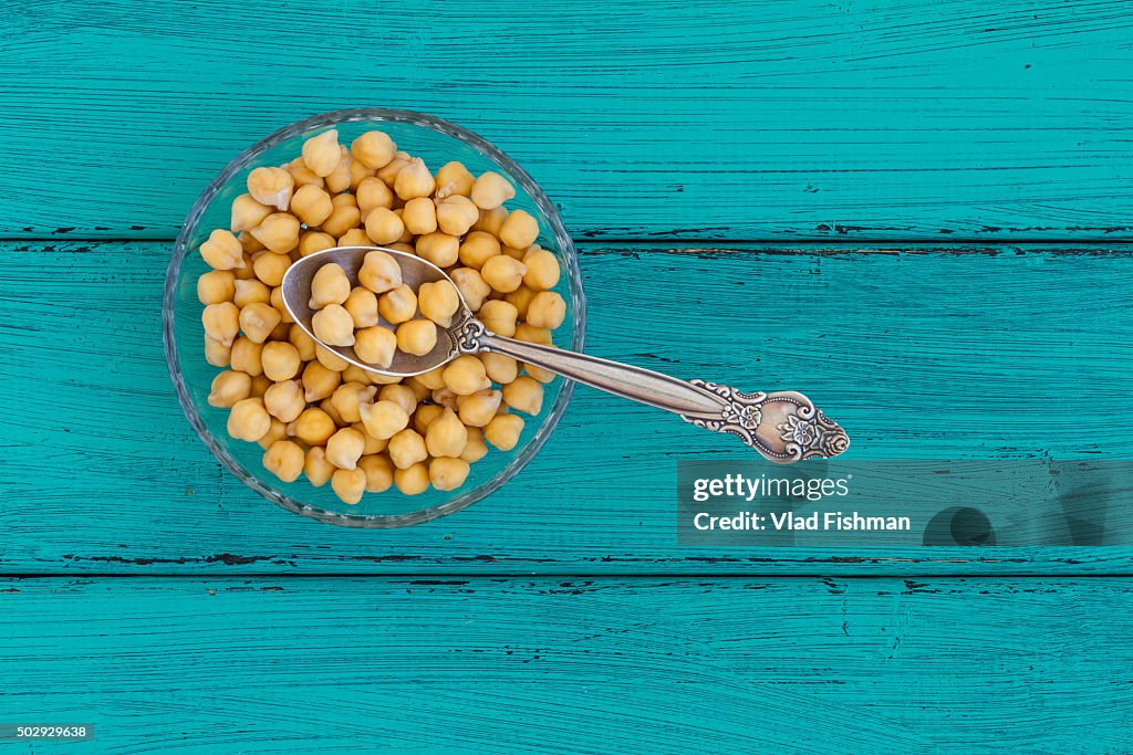 Chick peas on a wood background
