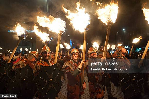 Men dressed as Vikings take part in the torchlight procession as it makes its way through Edinburgh for the start of the Hogmanay celebrations on...