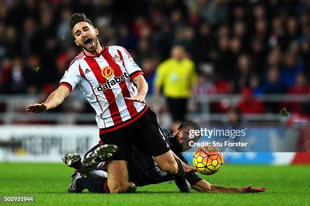 Emre Can of Liverpool fouls Fabio Borini of Sunderland during the Barclays Premier League match between Sunderland and Liverpool at Stadium of Light...