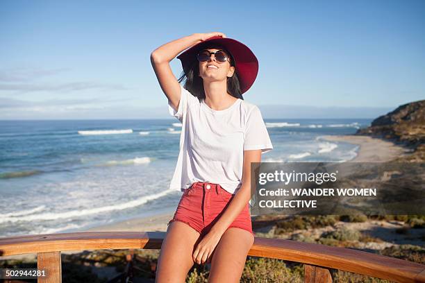 young woman in sunhat at beach lookout australia - composition stock pictures, royalty-free photos & images