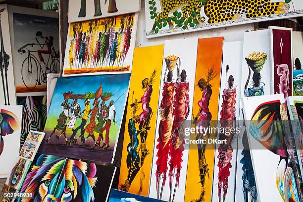 tingatinga paintings in tanzania - painted image paintings art stock pictures, royalty-free photos & images