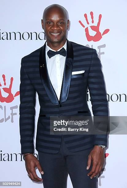 Sprinter Asafa Powell attends the Rihanna And The Clara Lionel Foundation 2nd Annual Diamond Ball at The Barker Hanger on December 10, 2015 in Santa...