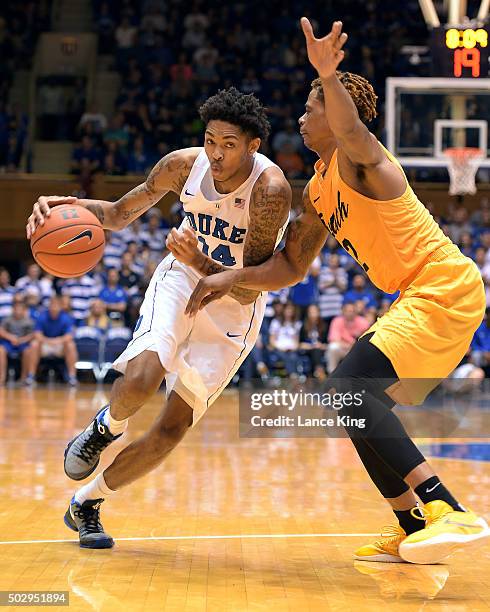 Brandon Ingram of the Duke Blue Devils drives against Nick Faust of the Long Beach State 49ers at Cameron Indoor Stadium on December 30, 2015 in...