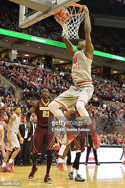 David Bell of the Ohio State Buckeyes slams in two points in the second half as Bakary Konate of the Minnesota Golden Gophers watches on December 30,...