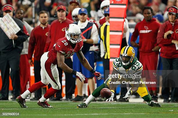 Wide receiver James Jones of the Green Bay Packers attempts a catch defended by cornerback Justin Bethel of the Arizona Cardinals during the NFL game...