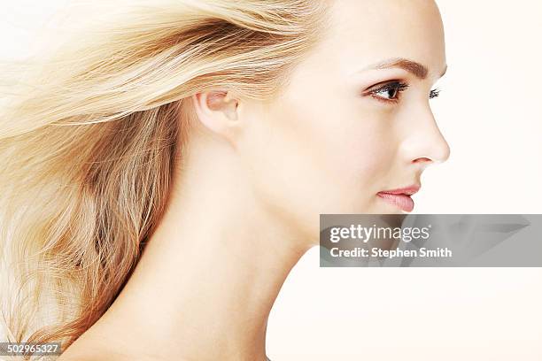 close up of woman hair blowing in wind - woman lipstick rearview stock pictures, royalty-free photos & images