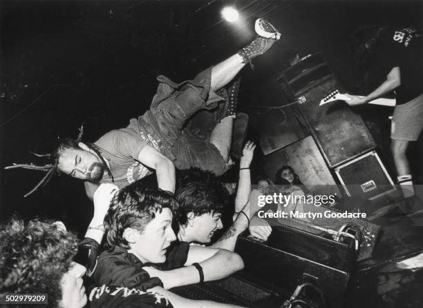 Stagediver at a Napalm Death gig at the ICA, London, United Kingdom, 1990.