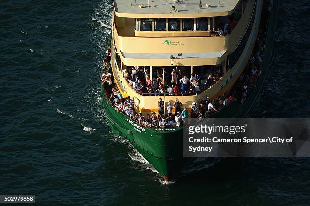 People arrive at Circular Quay onboard the ferry 'Freshwater' on New Year's Eve on Sydney Harbour on December 31, 2015 in Sydney, Australia.