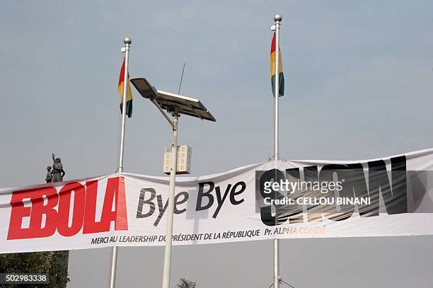 This photo taken on December 30, 2015 in Conakry shows a banner for the "Bye bye, Au revoir Ebola" memorial concert. International artists Youssou...