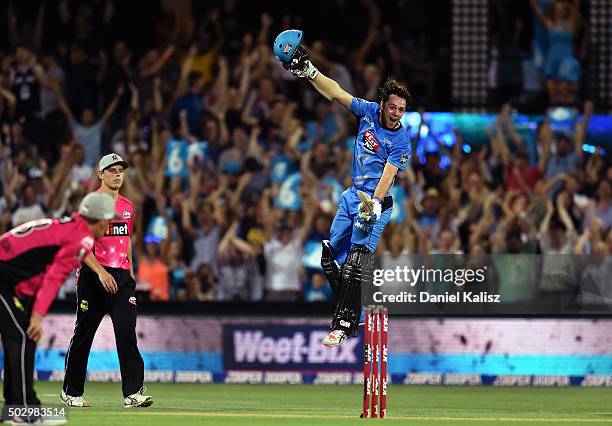 Travis Head of the Adelaide Strikers reacts after scoring his century and the winning runs during the Big Bash League match between the Adelaide...