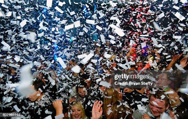 Club goers react as confetti falls during "Infamous Wednesdays" at Hyde Bellagio at the Bellagio on December 30, 2015 in Las Vegas, Nevada.