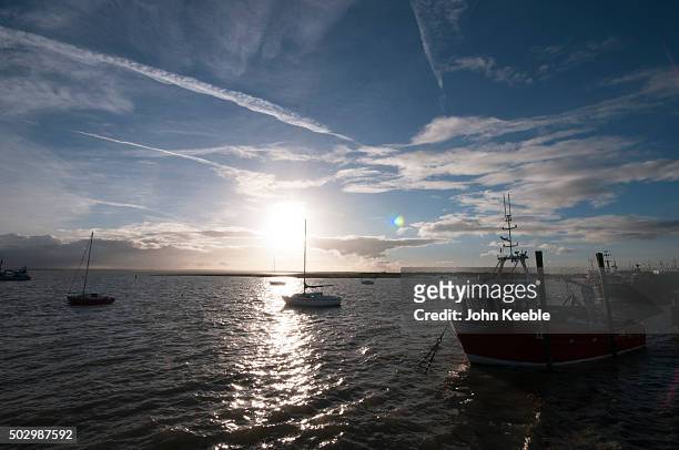 General view of cockle boats at sunset on the Thames Estuary on December 29, 2015 in Leigh on Sea, England.