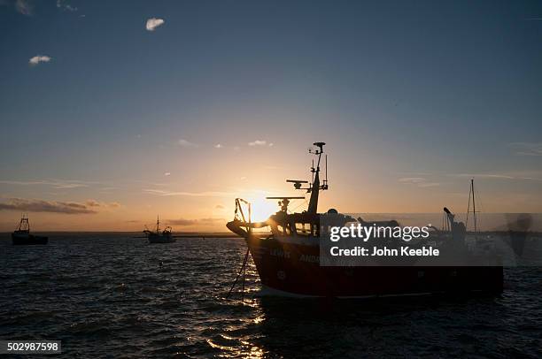 General view of cockle boats at sunset on the Thames Estuary on December 29, 2015 in Leigh on Sea, England.