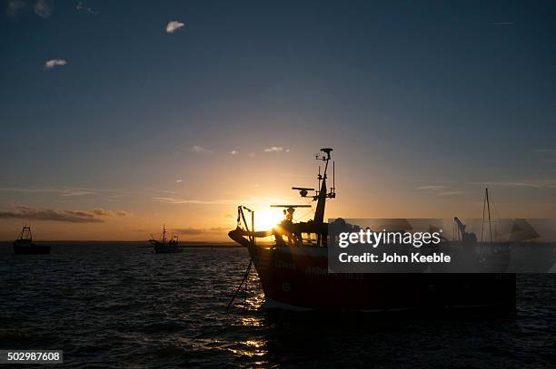 General view of cockle boats at sunset on the Thames Estuary on December 29, 2015 in Leigh on Sea, England.