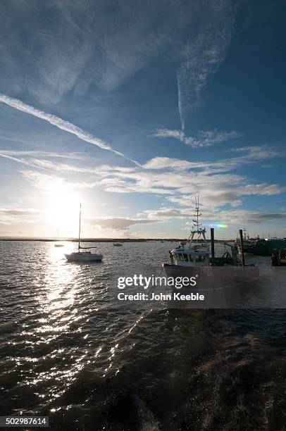 General view of cockle boats at sunset on the Thames Estuary on December 29, 2015 in Leigh on Sea, England.