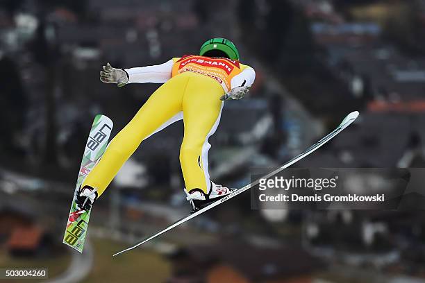 Peter Prevc of Slovenia soars throught the air during his training jump on Day 1 of the 64th Four Hills Tournament ski jumping event on December 31,...
