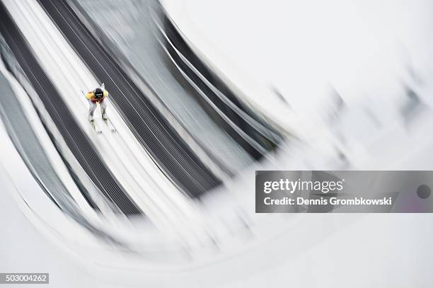 Peter Prevc of Slovenia accelerates down the inrun during his training jump on Day 1 of the 64th Four Hills Tournament ski jumping event on December...