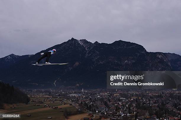 Severin Freund of Germany soars through the air during his training jump on Day 1 of the 64th Four Hills Tournament ski jumping event on December 31,...