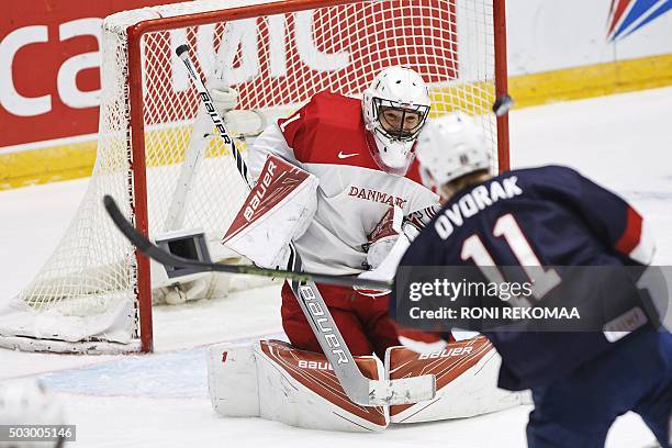 S Christian Dvorak fails to score against goalkeeper Mathias Seldrup of team Denmark during the 2016 IIHF World Junior Ice Hockey Championship match...