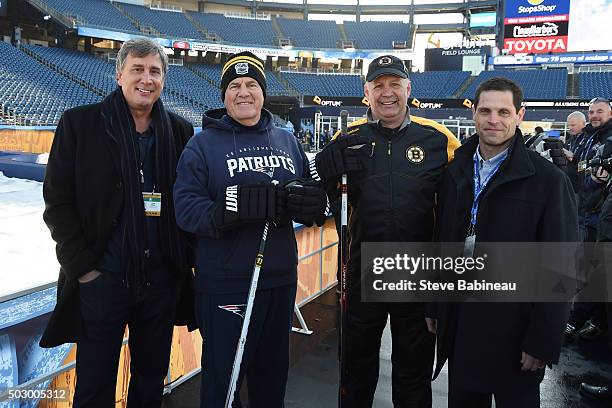 New England Patriots head coach Bill Belichick poses with Boston Bruins president Cam Neely, head coach Claude Julien and general manager Don Sweeny...