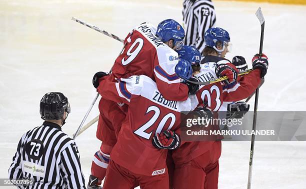 Czech players celebrate Jiri Smejkal's 1-1 equalizer during the 2016 IIHF World Junior U20 Ice Hockey Championships tournament match Finland vs Czech...