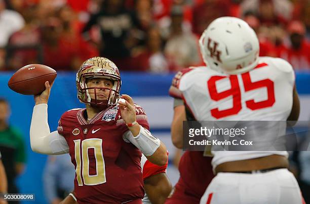 Quarterback Sean Maguire of the Florida State Seminoles looks to pass against the Houston Cougars in the first quarter during the Chick-fil-A Peach...