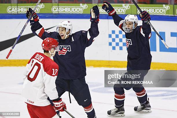 S 1-3 goal scorer Colin White and assist Matthew Tkachuk celebrate in front of Thomas Olsen of team Denmark during the 2016 IIHF World Junior U20 Ice...