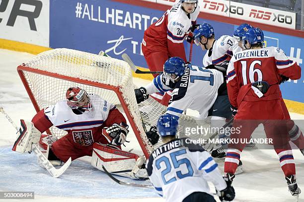 Finland's Kasper Bjorkqvist and Julius Nattinen attack against Czech Republic's goal guarded by Vitek Vanecek during the 2016 IIHF World Junior U20...