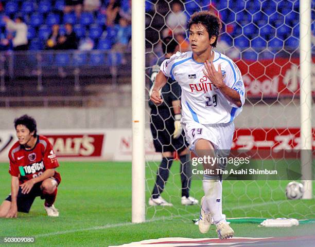 Hiroyuki Taniguchi of Kawasaki Frontale celebrates scoring his team's third goal during the J.League match between Kashima Antlers and Kawasaki...