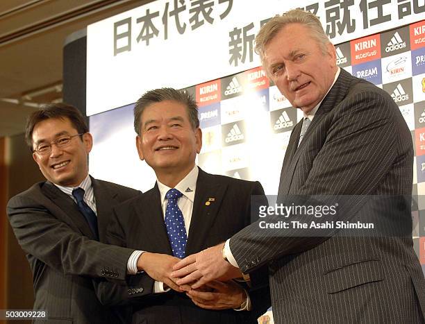 New Japan head coach Ivica Osim shakes hands with Japan Football Association President Saburo Kawabuchi and Men's U-21 head coach Yasuharu Sorimachi...