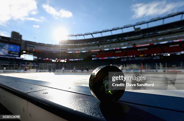 Puck with the 2016 Bridgestone NHL Classic logo is seen before practice at Gillette Stadium on December 31, 2015 in Foxboro, Massachusetts. The 2016...