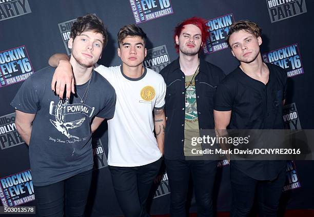 Musicians Luke Hemmings, Calum Hood, Michael Clifford and Ashton Irwin of 5 Seconds Of Summer attend Dick Clark's New Year's Rockin' Eve with Ryan...