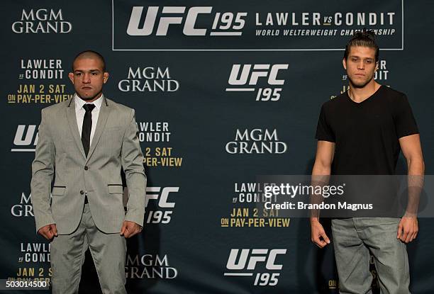 Diego Brandao and Brian Ortega pose for a photo after facing off during the Ultimate Media Day at the MGM Grand Hotel/Casino on December 31, 2015 in...