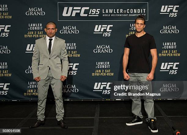 Diego Brandao and Brian Ortega pose for a photo after facing off during the Ultimate Media Day at the MGM Grand Hotel/Casino on December 31, 2015 in...