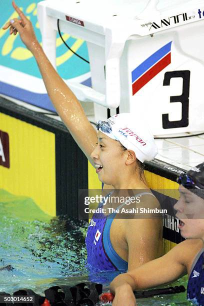 Hanae Ito of Japan celebrates winning the Women's 100m during day one of the Pan Pacific Swimming Championships at the Saanich Commonwealth Place on...