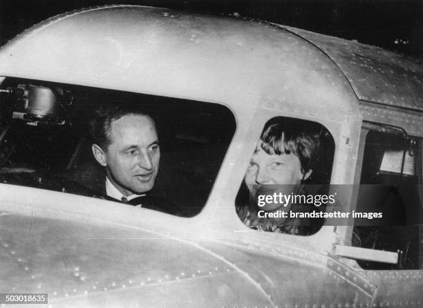 The American Amelia Earhart with her companion Harry Manning a few days before the start of her flight around the equator. 13th March 1937....