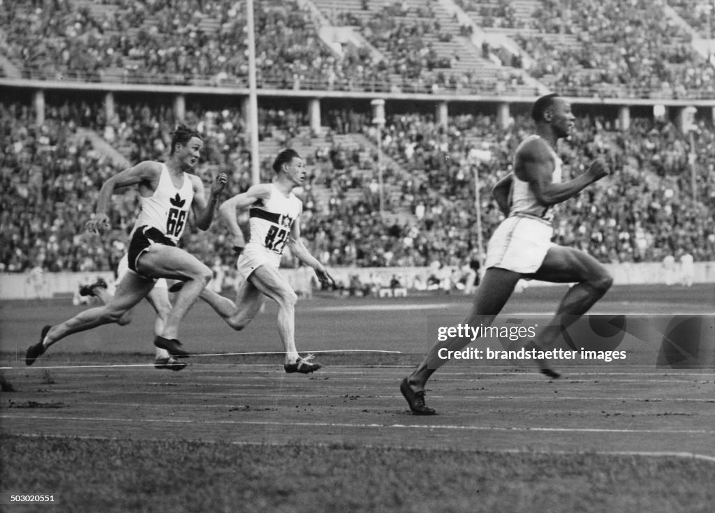 The American Runner Jesse Owens Running In The 200-Meter Sprint A New Olympic Record. Berlin. 4Th August 1936. Photograph.