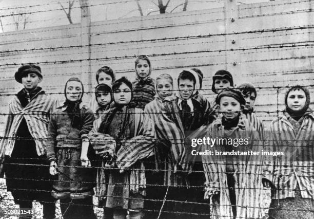Survivor children in the concentration camp Auschwitz-Birkenau after the liberation. 1945. Poland. Photograph. February 1945. .