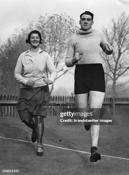 The British boxer John Pettifer with his sister during training. About 1930. Photograph.