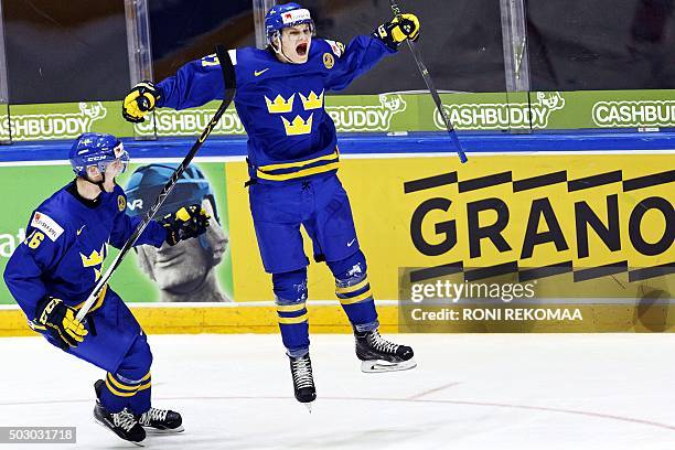 Sweden's Christoffer Ehn and 1-4 goal scorer Anton Karlsson celebrate during the 2016 IIHF World Junior U20 Ice Hockey Championships tournament match...