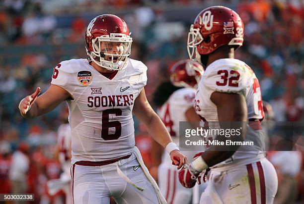 Baker Mayfield of the Oklahoma Sooners and Samaje Perine of the Oklahoma Sooners celebrate scoring a touchdown during the first quarter against the...