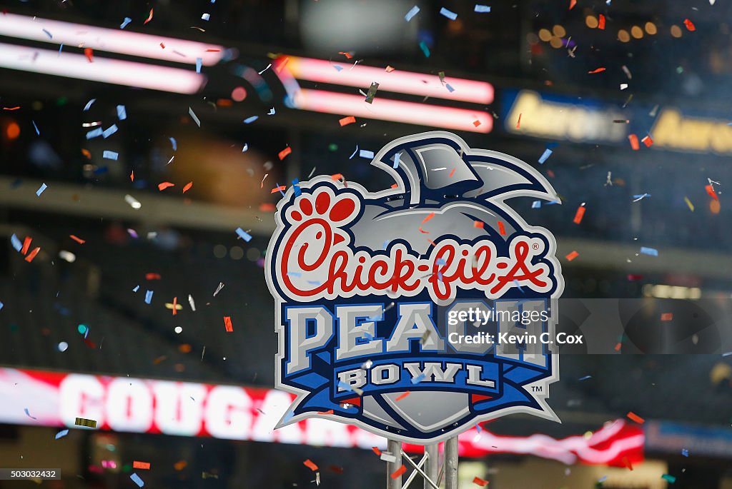 ChickfilA Peach Bowl signage is seen as confetti falls after the