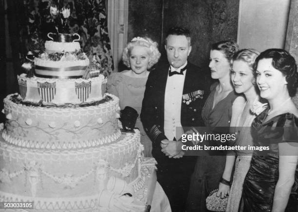 The aviator and polar explorer Richard E. Byrd at a ceremony for President Roosevelt. With Alice Faye - Betty Furness - Glenda Farrell - Sue Gomez....