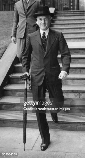 The British Home Secretary Samuel Hoare on leaving Downing Street 10. 30th August 1938. Photograph.