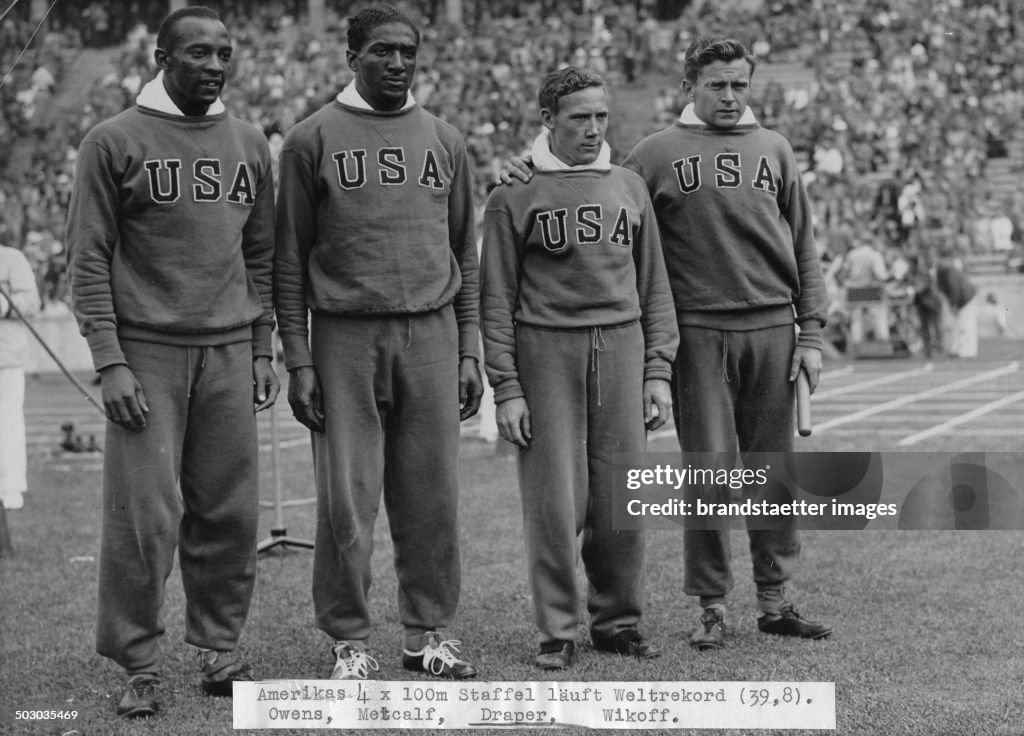 The American 4 X 100 Meters Team Wins The Gold Medal. From Left To Right Jessie Owens - Ralph Metcalf - Foy Draper - Frank Wykoff. Olympic Games In Berlin. 9Th August 1936.  Photograph.