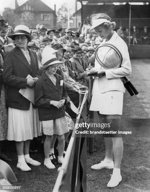 The American tennis player Alice Marble on the tennis court of Surbiton Lawn Tennis Club. 17th May 1937. Photograph.