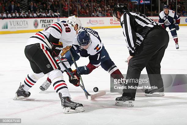 John Mitchell of the Colorado Avalanche faces off against Jonathan Toews of the Chicago Blackhawks at the Pepsi Center on December 31, 2015 in...
